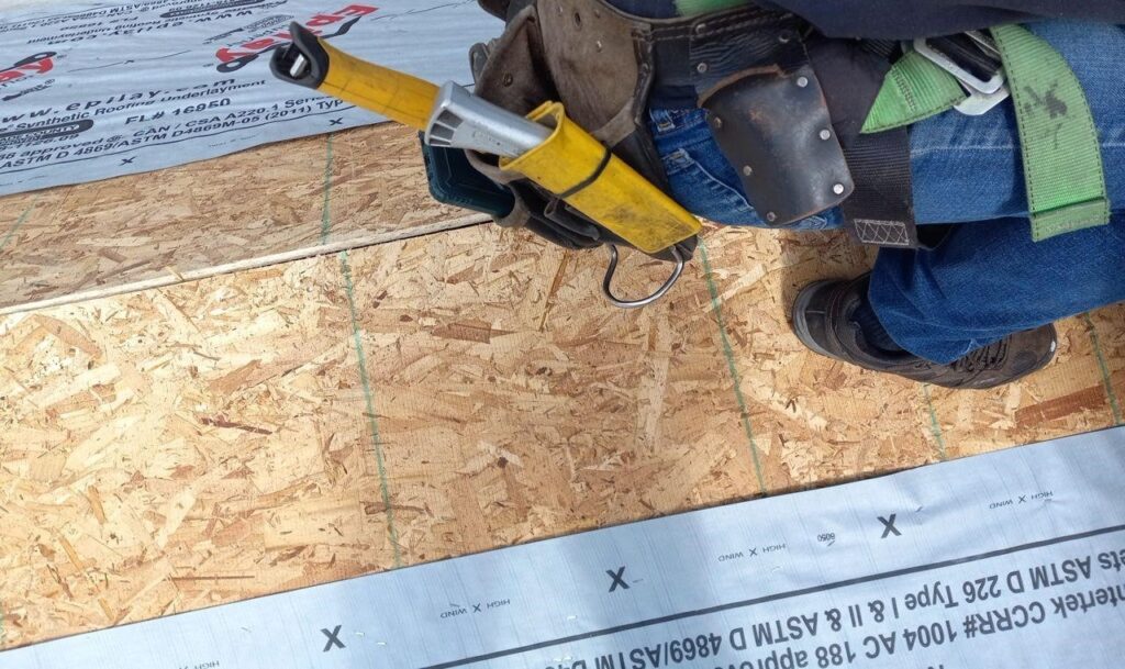 A man prepares the roof for finishing